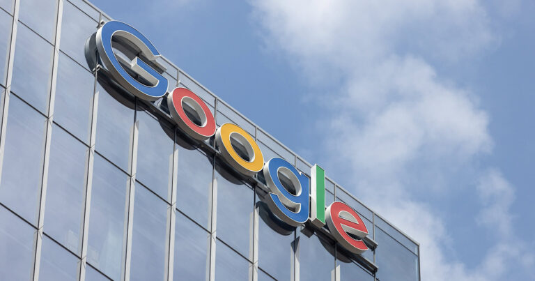 Looking up at an angle at the Google sign on the Head Office for Canada