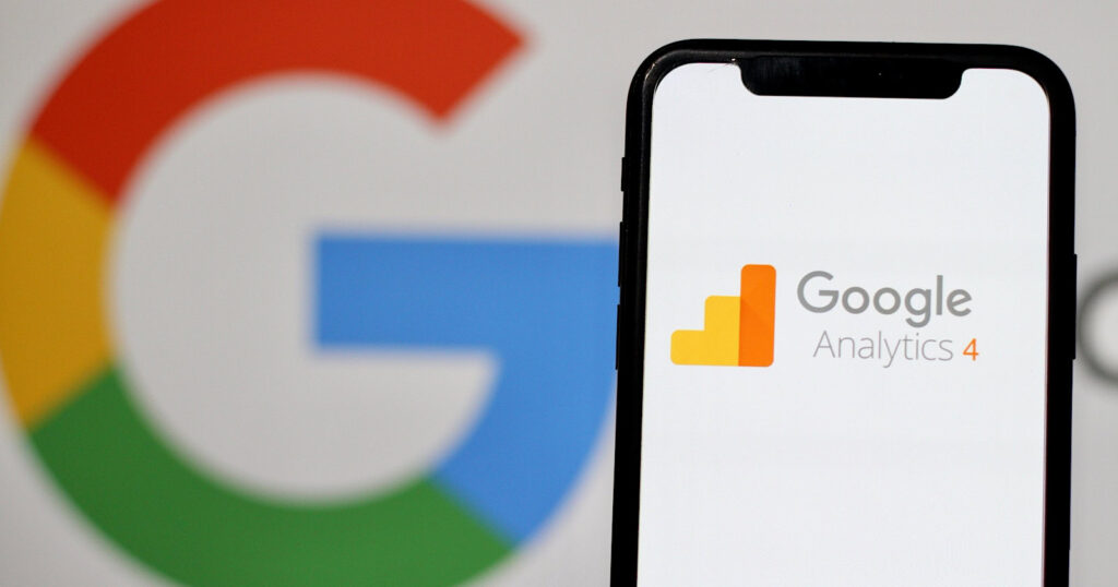 In this photo illustration,the logo of Google Analytics 4,is displayed on a smartphone